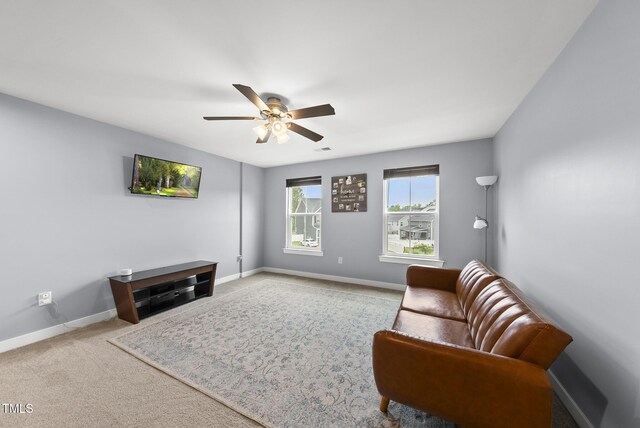 2909 Landon Pines Ct, New Hill, NC 27562 - carpeted living area with a ceiling fan and baseboards