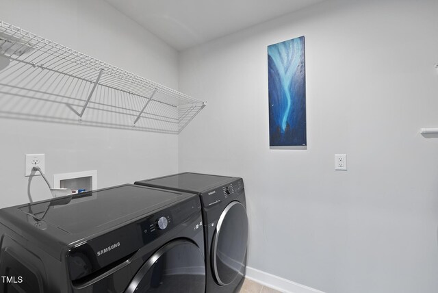 2909 Landon Pines Ct, New Hill, NC 27562 - washroom with washer and dryer, baseboards, and tile patterned flooring