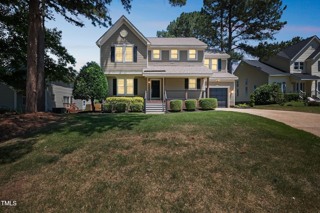 5505 Pennfine Dr, Raleigh, NC 27610 - view of front of house with driveway, a porch, a garage, a lawn, and roof with shingles