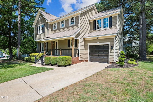 5505 Pennfine Dr, Raleigh, NC 27610 - traditional home with covered porch, a shingled roof, a garage, a front lawn, and driveway