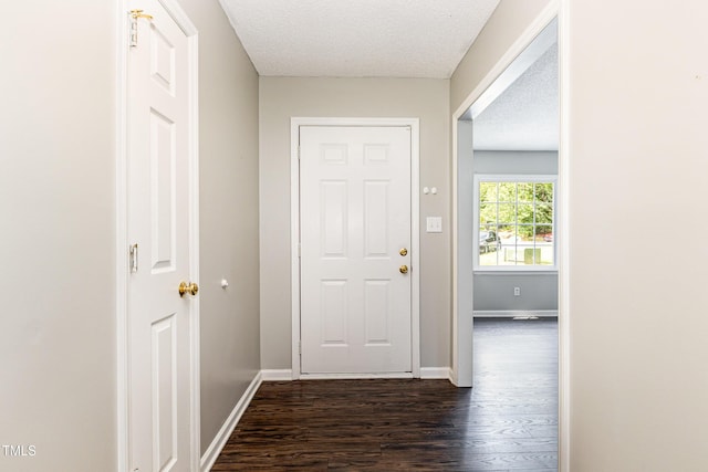 5008 Dantonville Ct, Knightdale, NC 27545 - hallway featuring dark wood-style flooring, baseboards, and a textured ceiling