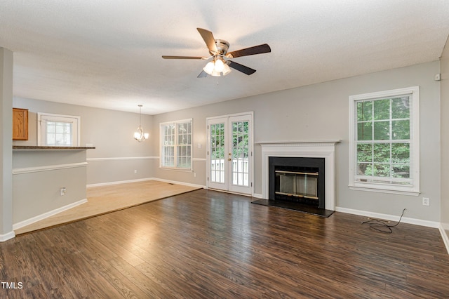 5008 Dantonville Ct, Knightdale, NC 27545 - unfurnished living room with a ceiling fan, a glass covered fireplace, wood finished floors, and baseboards