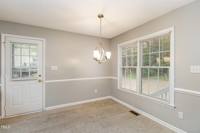 5008 Dantonville Ct, Knightdale, NC 27545 - unfurnished dining area with a chandelier and baseboards