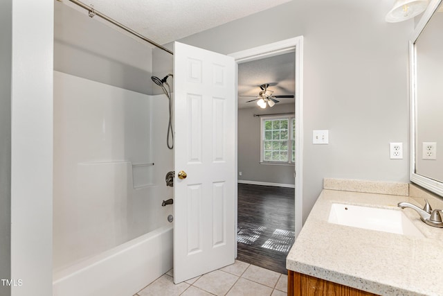 5008 Dantonville Ct, Knightdale, NC 27545 - bathroom with vanity, tile patterned flooring, shower / tub combination, a textured ceiling, and a ceiling fan