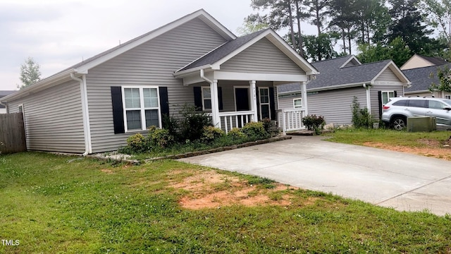 764 Grove Creek Ln, Raleigh, NC 27610 - view of front of house featuring covered porch and a front yard