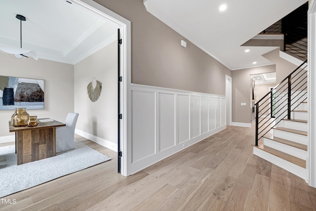 5406 Garrett Rd, Durham, NC 27707 - stairway featuring ornamental molding, wood finished floors, wainscoting, recessed lighting, and a decorative wall