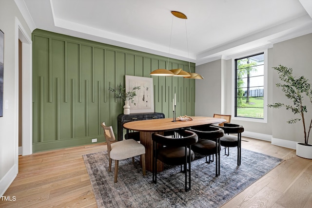 5406 Garrett Rd, Durham, NC 27707 - dining room featuring a tray ceiling and light wood finished floors