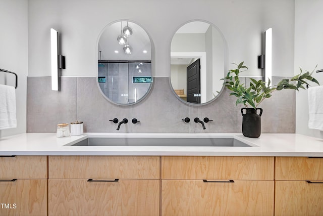 5406 Garrett Rd, Durham, NC 27707 - full bath featuring double vanity and backsplash