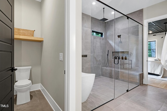 5406 Garrett Rd, Durham, NC 27707 - full bath featuring a freestanding bath, a stall shower, and tile patterned floors