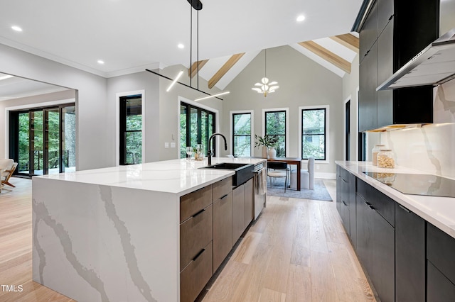 5406 Garrett Rd, Durham, NC 27707 - kitchen with modern cabinets, ventilation hood, a spacious island, light wood-type flooring, and light stone countertops