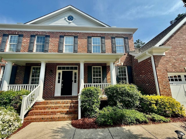 9409 Collingdale Way, Raleigh, NC 27617 - view of front of home with brick siding and a porch