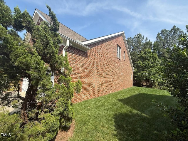 9409 Collingdale Way, Raleigh, NC 27617 - view of home's exterior with brick siding and a lawn