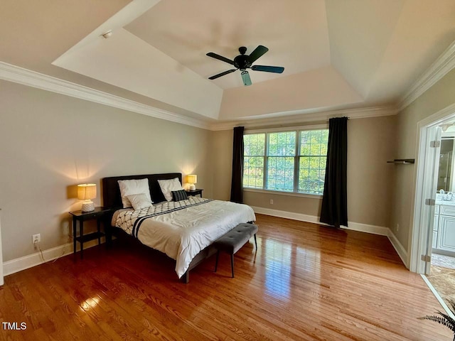 9409 Collingdale Way, Raleigh, NC 27617 - bedroom featuring a raised ceiling, wood finished floors, baseboards, ornamental molding, and a ceiling fan
