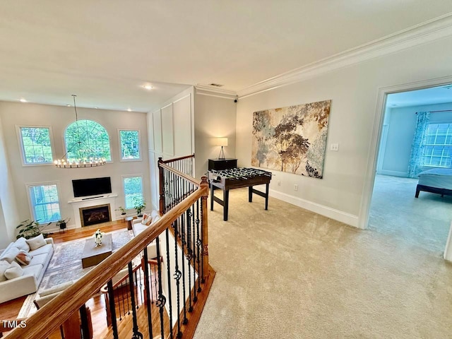 9409 Collingdale Way, Raleigh, NC 27617 - hall with plenty of natural light, light colored carpet, baseboards, crown molding, and an upstairs landing