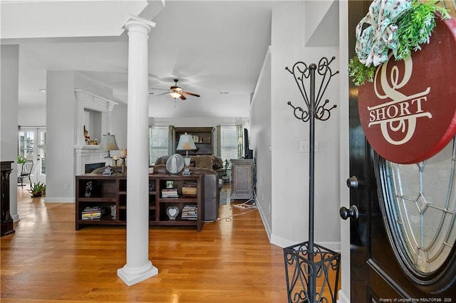 3811 Briargate Ln, Fayetteville, NC 28314 - entryway featuring light wood-style floors, baseboards, ceiling fan, and decorative columns