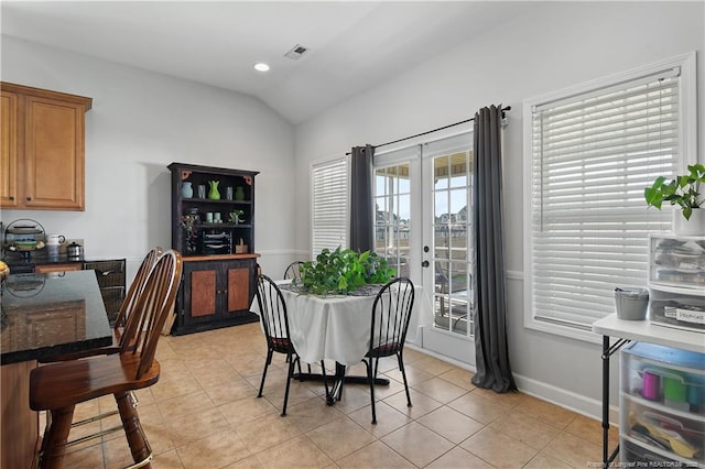 3811 Briargate Ln, Fayetteville, NC 28314 - dining area featuring vaulted ceiling, french doors, light tile patterned floors, baseboards, and recessed lighting