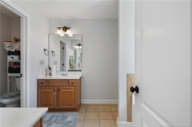 3811 Briargate Ln, Fayetteville, NC 28314 - full bath featuring vanity, tile patterned flooring, toilet, and baseboards