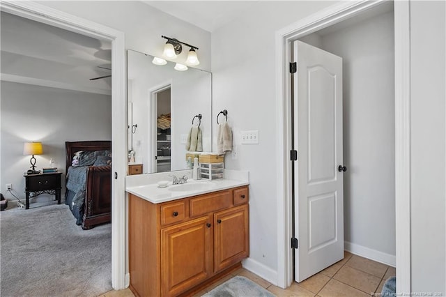 3811 Briargate Ln, Fayetteville, NC 28314 - ensuite bathroom with vanity, tile patterned floors, and baseboards