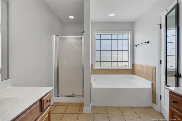 3811 Briargate Ln, Fayetteville, NC 28314 - bathroom with vanity, a stall shower, tile patterned floors, and healthy amount of natural light