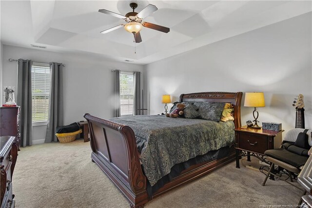 3811 Briargate Ln, Fayetteville, NC 28314 - bedroom with a tray ceiling, carpet floors, and a ceiling fan