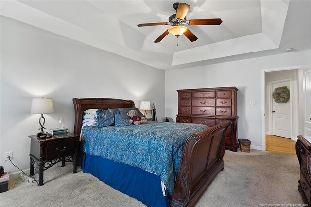 3811 Briargate Ln, Fayetteville, NC 28314 - bedroom featuring a tray ceiling, carpet, and a ceiling fan