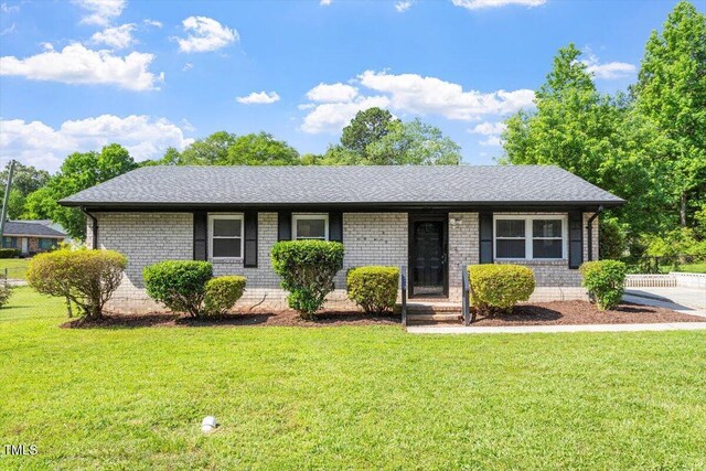 1512 Bacon St, Durham, NC 27701 - ranch-style house featuring a front yard, brick siding, and a shingled roof