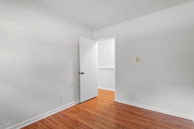 1512 Bacon St, Durham, NC 27701 - unfurnished room featuring baseboards and wood finished floors