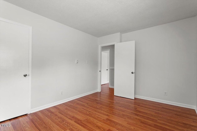 1512 Bacon St, Durham, NC 27701 - unfurnished room featuring wood finished floors and baseboards