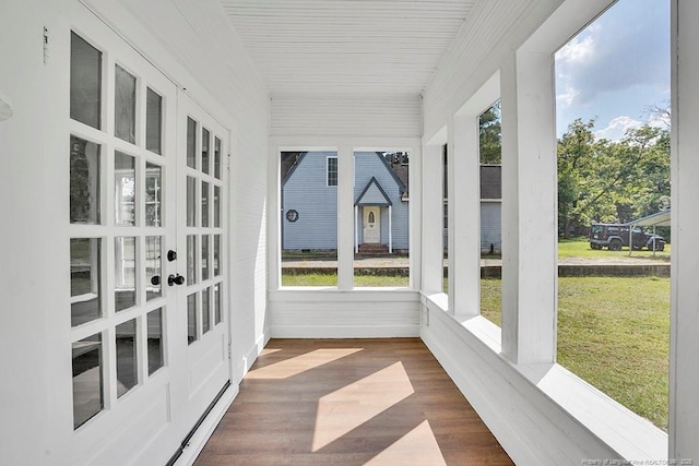201 N College St, Red Springs, NC 28377 - unfurnished sunroom with wood finished floors, french doors, and baseboards