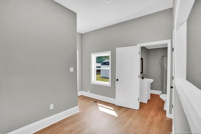 201 N College St, Red Springs, NC 28377 - empty room with light wood-type flooring and baseboards