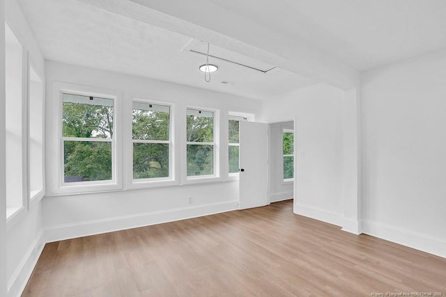 201 N College St, Red Springs, NC 28377 - unfurnished room featuring wood finished floors, baseboards, and attic access