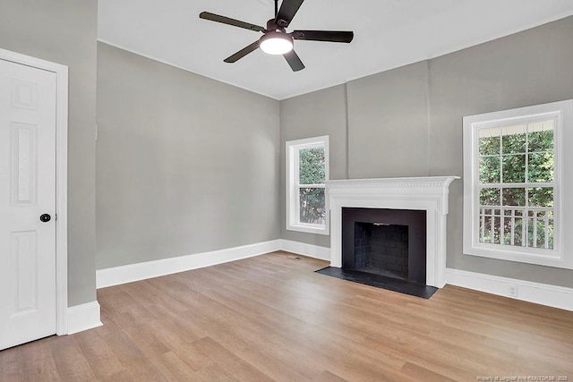 201 N College St, Red Springs, NC 28377 - unfurnished living room with wood finished floors, plenty of natural light, baseboards, and ceiling fan