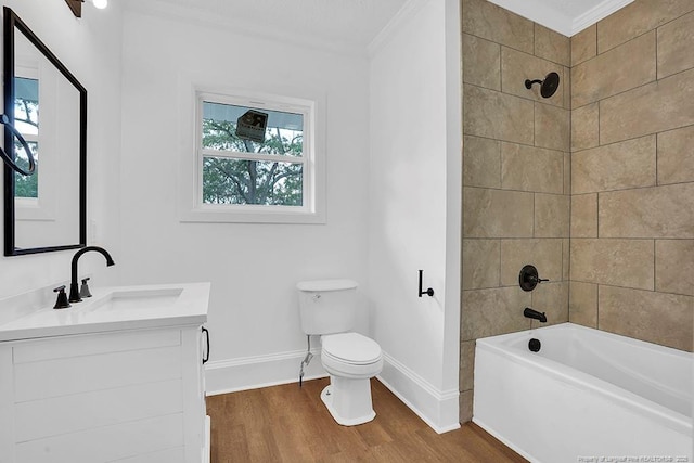 201 N College St, Red Springs, NC 28377 - full bathroom with ornamental molding, vanity, wood finished floors, baseboards, and toilet