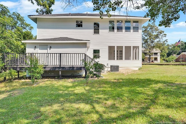 201 N College St, Red Springs, NC 28377 - rear view of property featuring central AC unit, a yard, and a wooden deck
