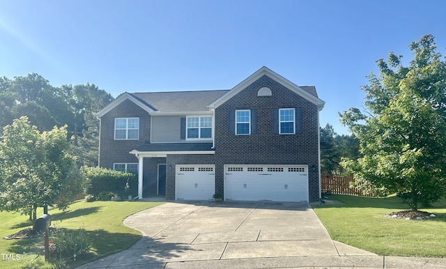 1116 Powder, Fuquay Varina, NC 27526 - view of front of house featuring a garage, driveway, and brick siding