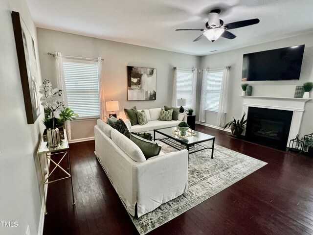 1116 Powder, Fuquay Varina, NC 27526 - living area featuring ceiling fan, hardwood / wood-style floors, and a fireplace with flush hearth