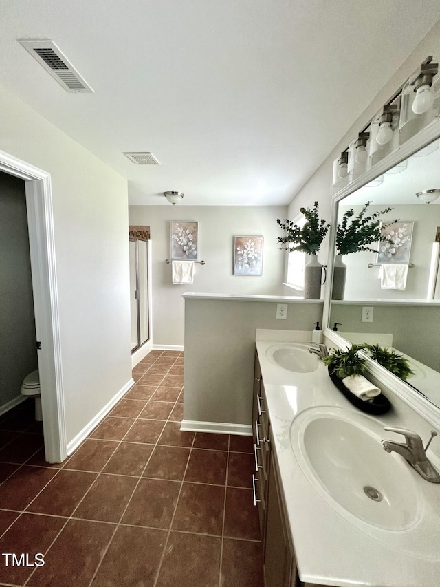 1116 Powder, Fuquay Varina, NC 27526 - full bathroom featuring double vanity, tile patterned flooring, and a shower with door