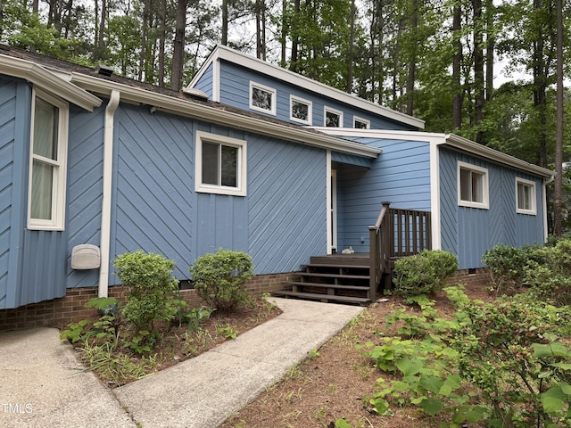 507 Holtz Ln, Cary, NC 27511 - view of side of home featuring crawl space and view of scattered trees
