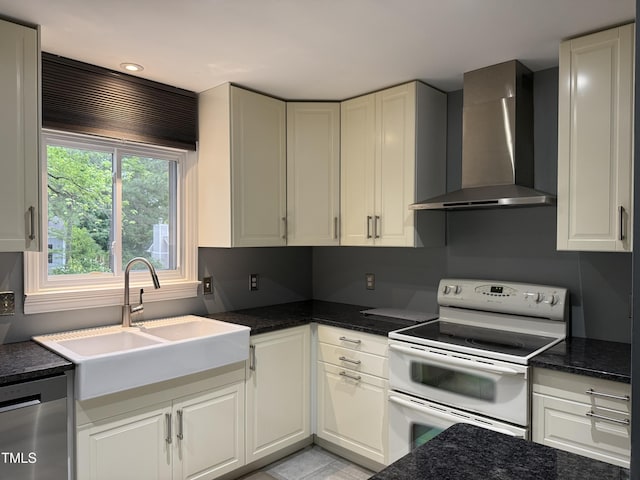 507 Holtz Ln, Cary, NC 27511 - kitchen featuring wall chimney exhaust hood, white electric range, dishwasher, a sink, and white cabinets