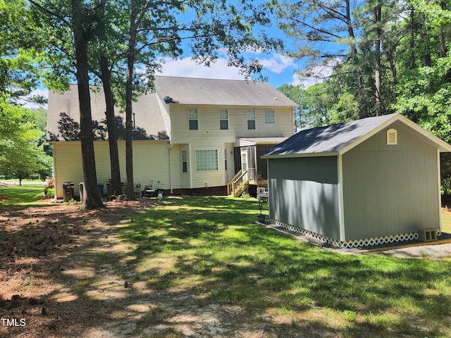 18 Clover Hil Pl, Durham, NC 27712 - back of property featuring a storage unit and a yard