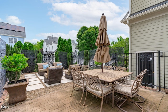321 Commons Walk Cir, Cary, NC 27519 - fenced backyard featuring a patio and outdoor dining area
