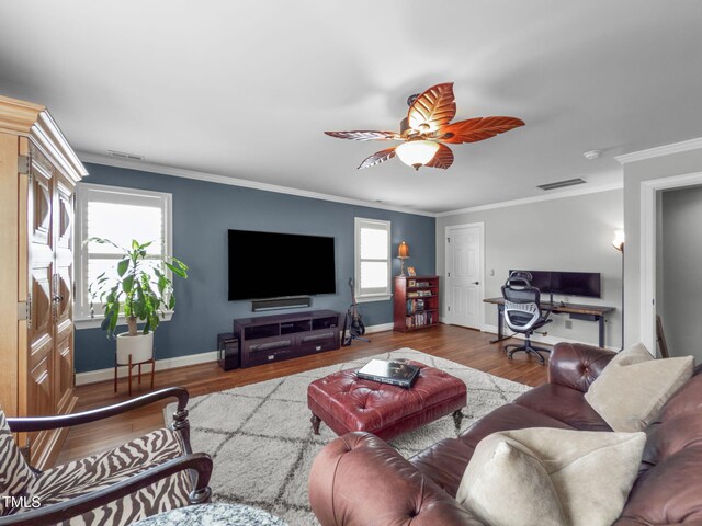 321 Commons Walk Cir, Cary, NC 27519 - living area featuring wood finished floors, ornamental molding, ceiling fan, baseboards, and a desk