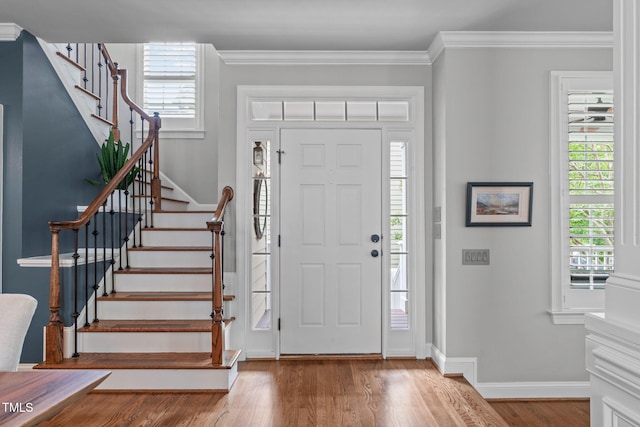 321 Commons Walk Cir, Cary, NC 27519 - foyer with stairs, wood finished floors, baseboards, and crown molding