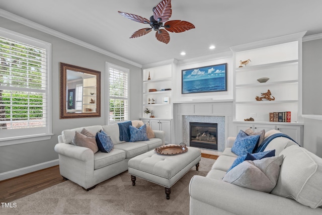 321 Commons Walk Cir, Cary, NC 27519 - living area featuring ornamental molding, a ceiling fan, wood finished floors, baseboards, and a fireplace