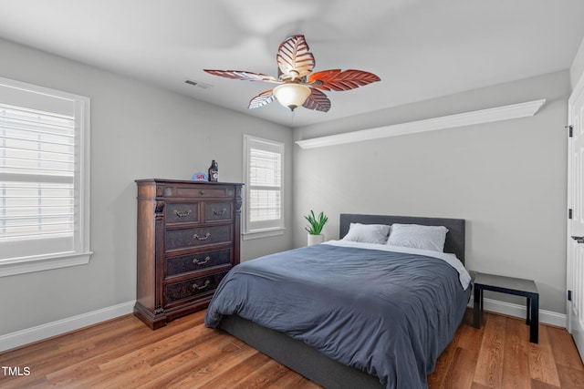 321 Commons Walk Cir, Cary, NC 27519 - bedroom with wood finished floors, baseboards, and ceiling fan