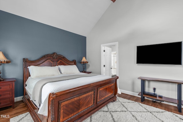 321 Commons Walk Cir, Cary, NC 27519 - bedroom featuring wood finished floors, high vaulted ceiling, ensuite bath, and baseboards