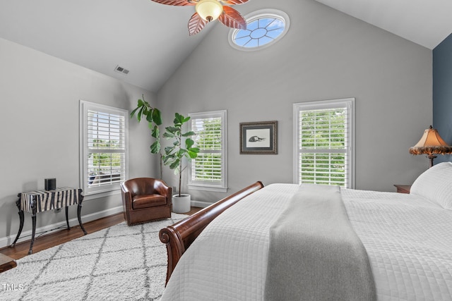321 Commons Walk Cir, Cary, NC 27519 - bedroom featuring high vaulted ceiling, wood finished floors, multiple windows, and baseboards