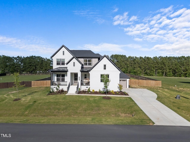 105 Scotland Dr, Youngsville, NC 27596 - modern farmhouse style home featuring driveway, a porch, a standing seam roof, metal roof, and a garage