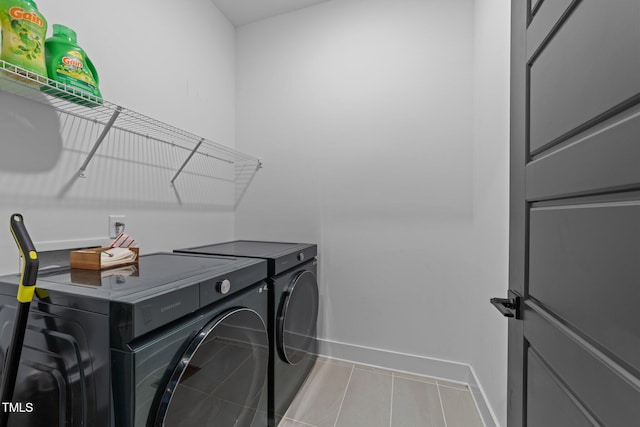 105 Scotland Dr, Youngsville, NC 27596 - washroom with separate washer and dryer, baseboards, and tile patterned floors