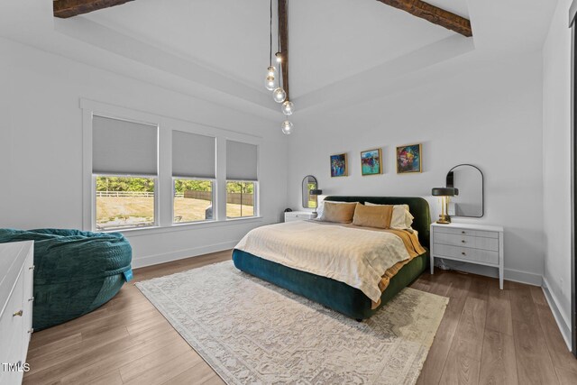 105 Scotland Dr, Youngsville, NC 27596 - bedroom featuring beamed ceiling, wood finished floors, and baseboards